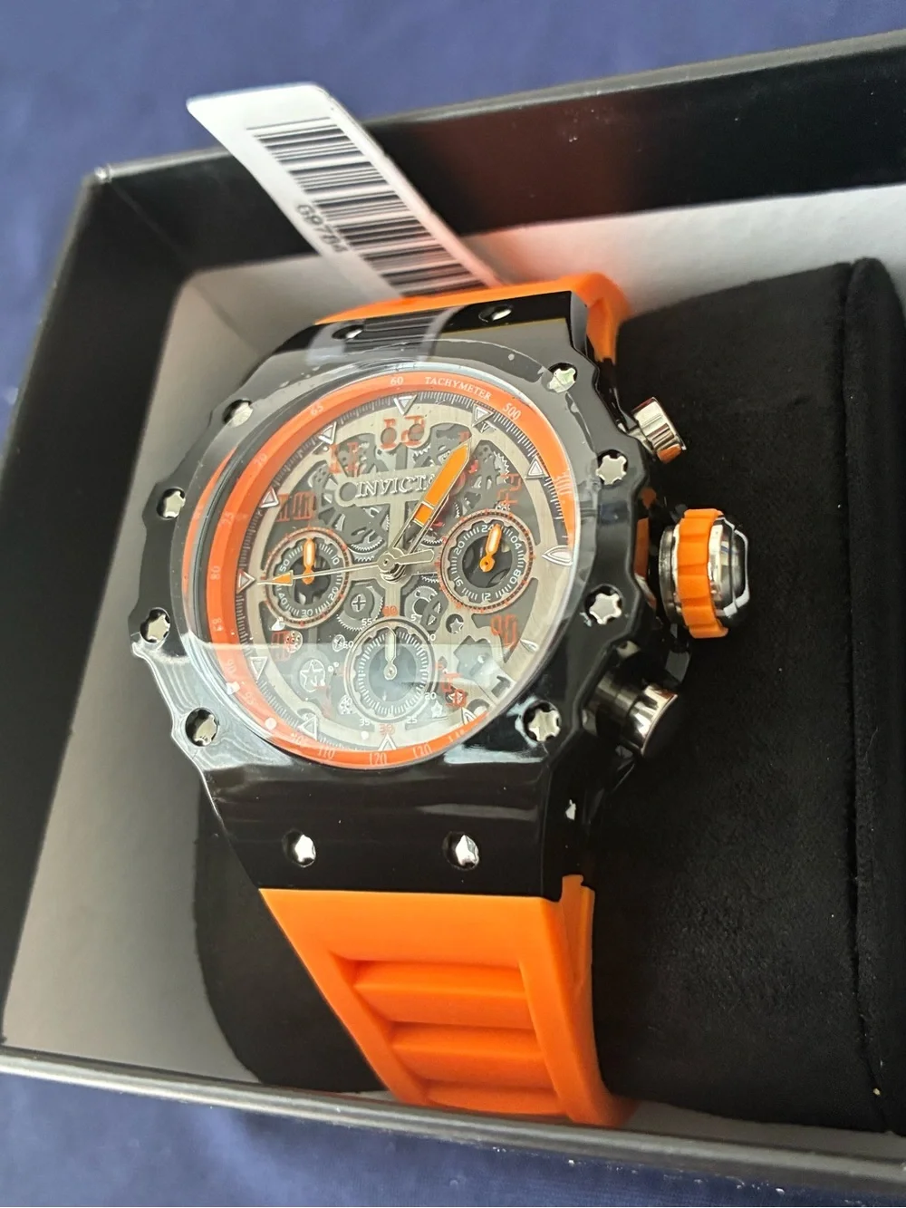 Invicta chronograph visible